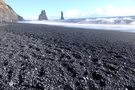 Some of the black "sand" is still pebbles Some of the black "sand" is still pebbles